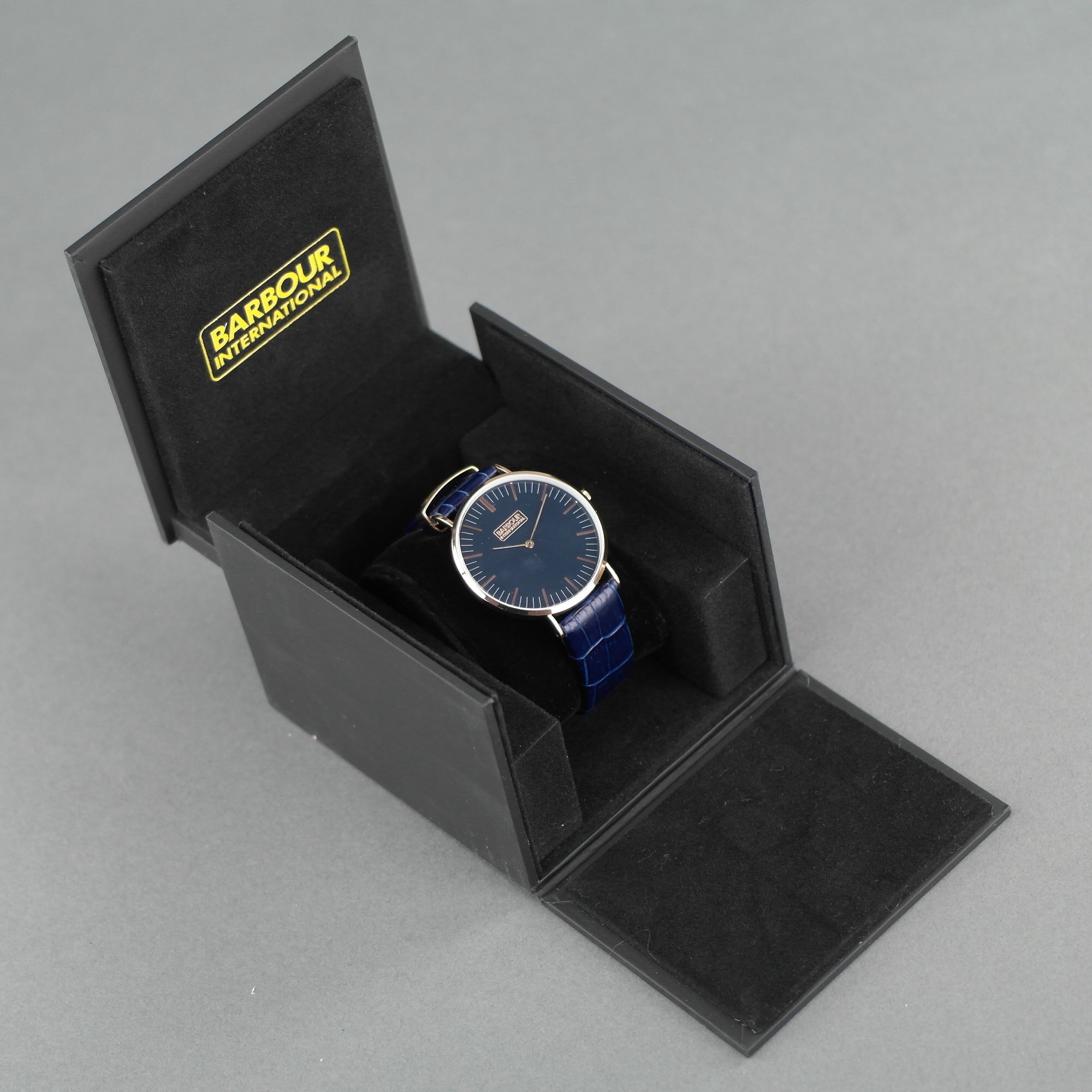 Barbour Hartley Reloj de pulsera chapado en oro con esfera negra y correa de cuero azul