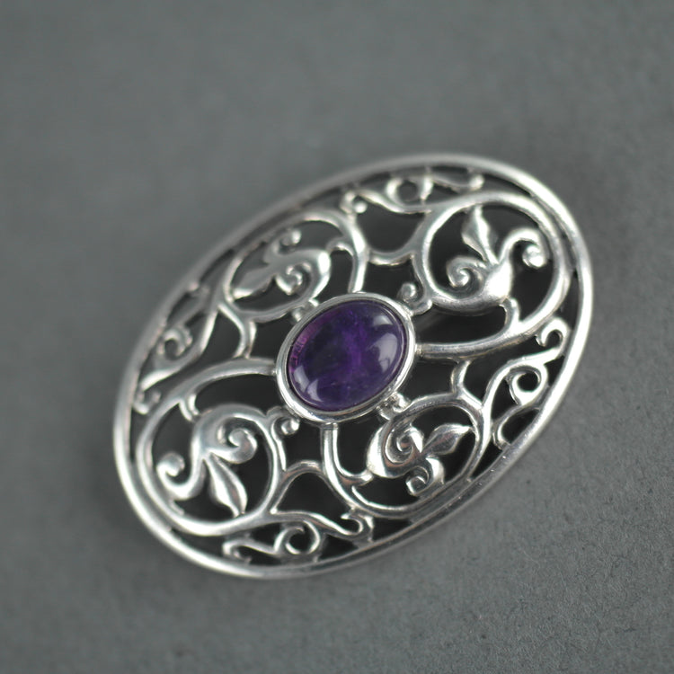 Vintage sterling silver pin brooch with amethyst cabochon