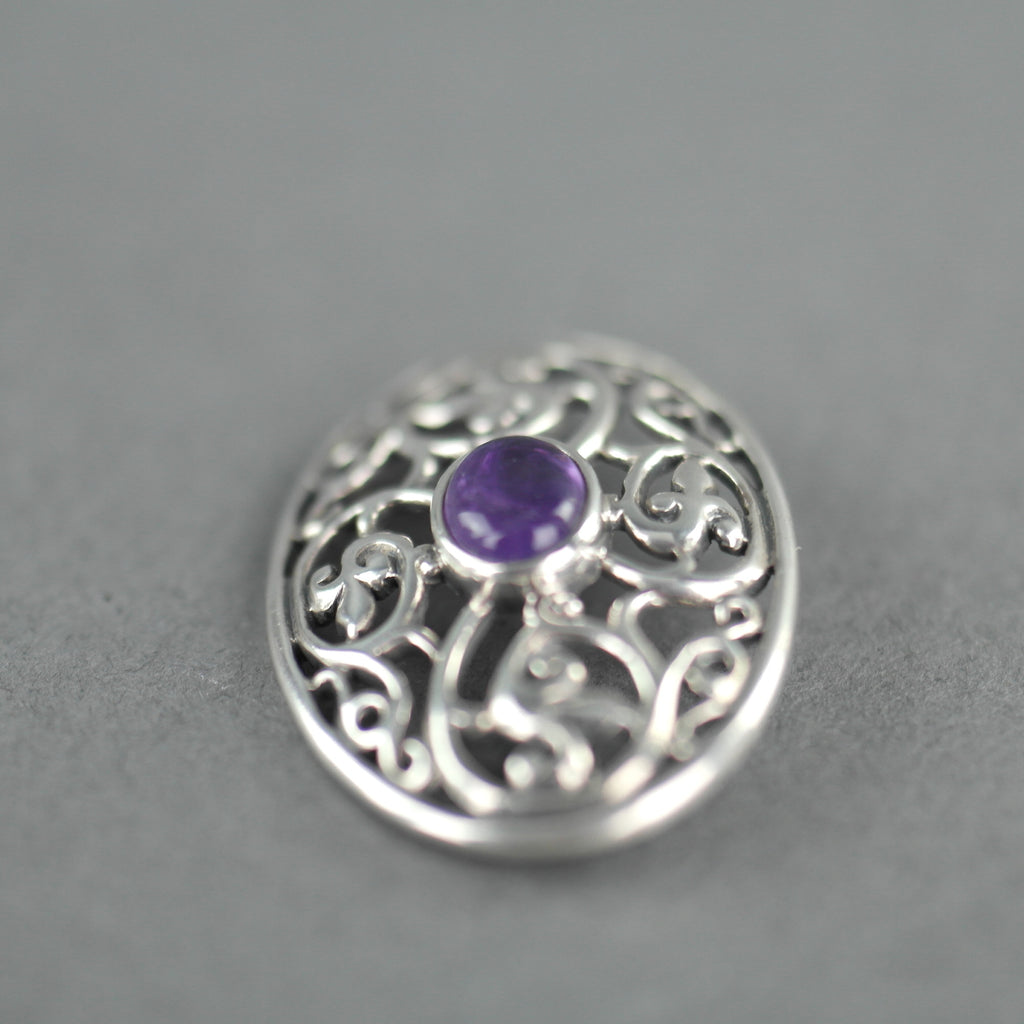Vintage sterling silver pin brooch with amethyst cabochon
