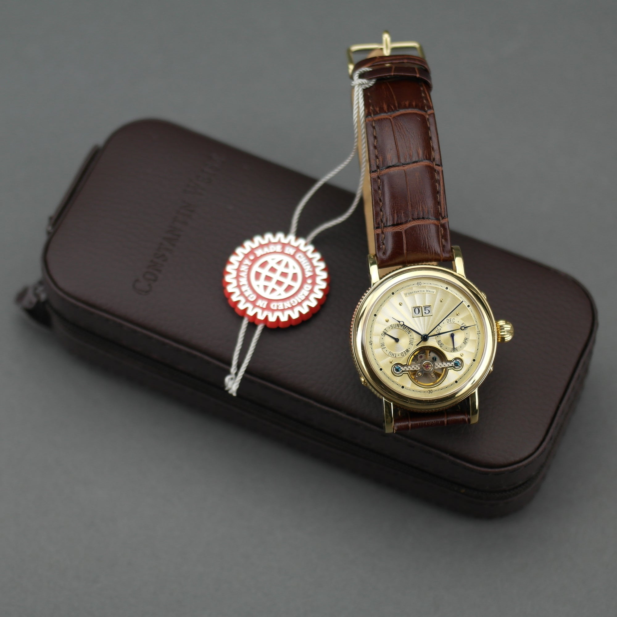 Constantin Weisz Automatik-Armbanduhr mit offenem Herzen, vergoldet, braunes Lederarmband