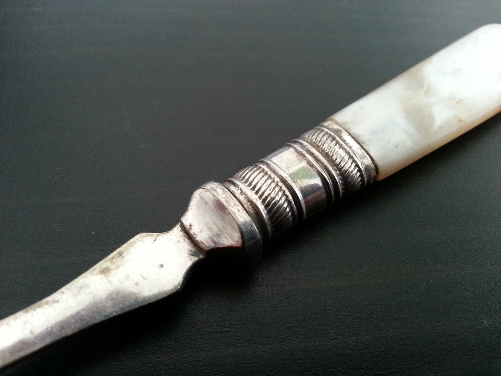 Antique ornamented desert silver plate spoon mother of pearl handle