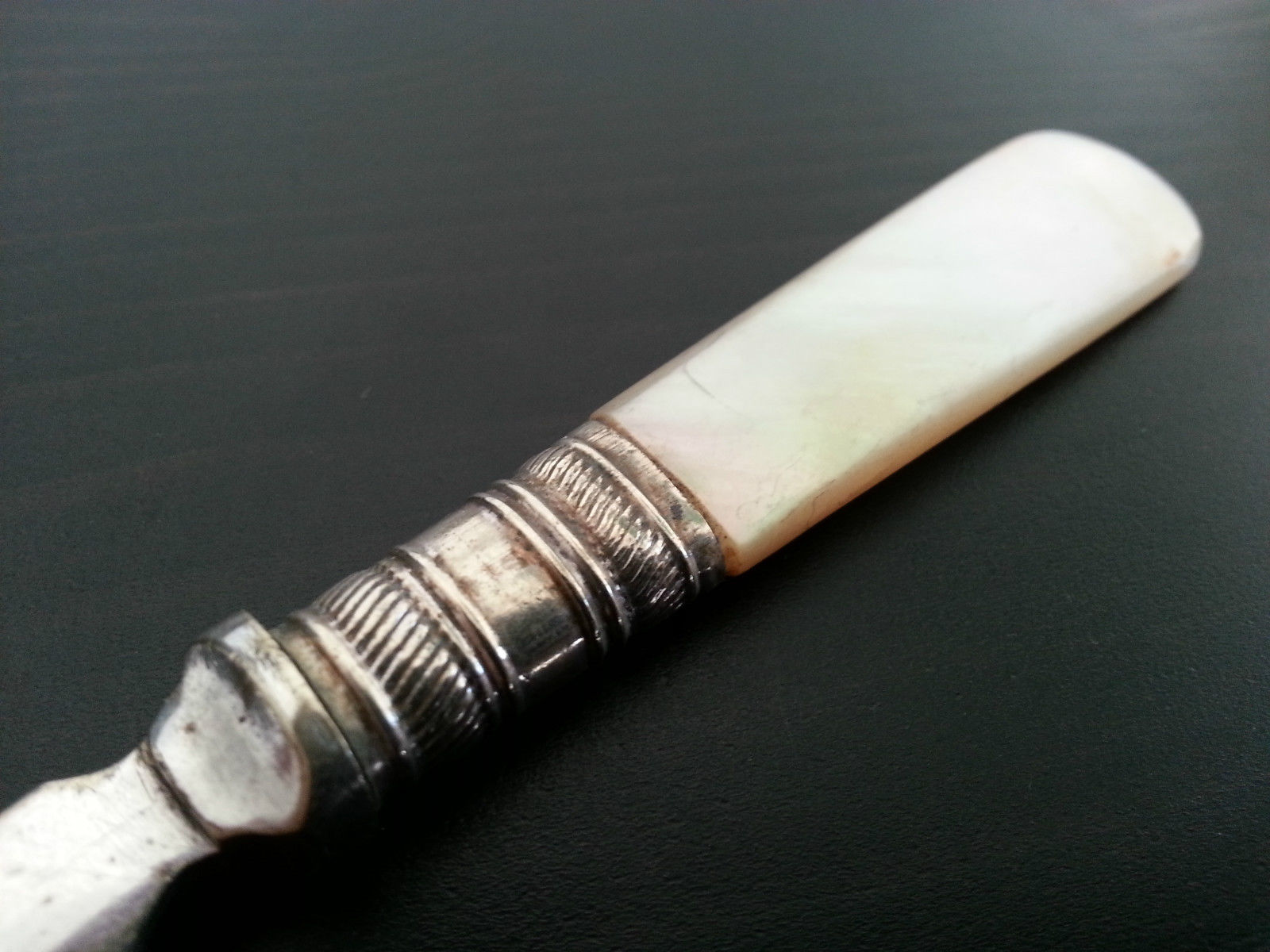 Antique ornamented desert silver plate spoon mother of pearl handle