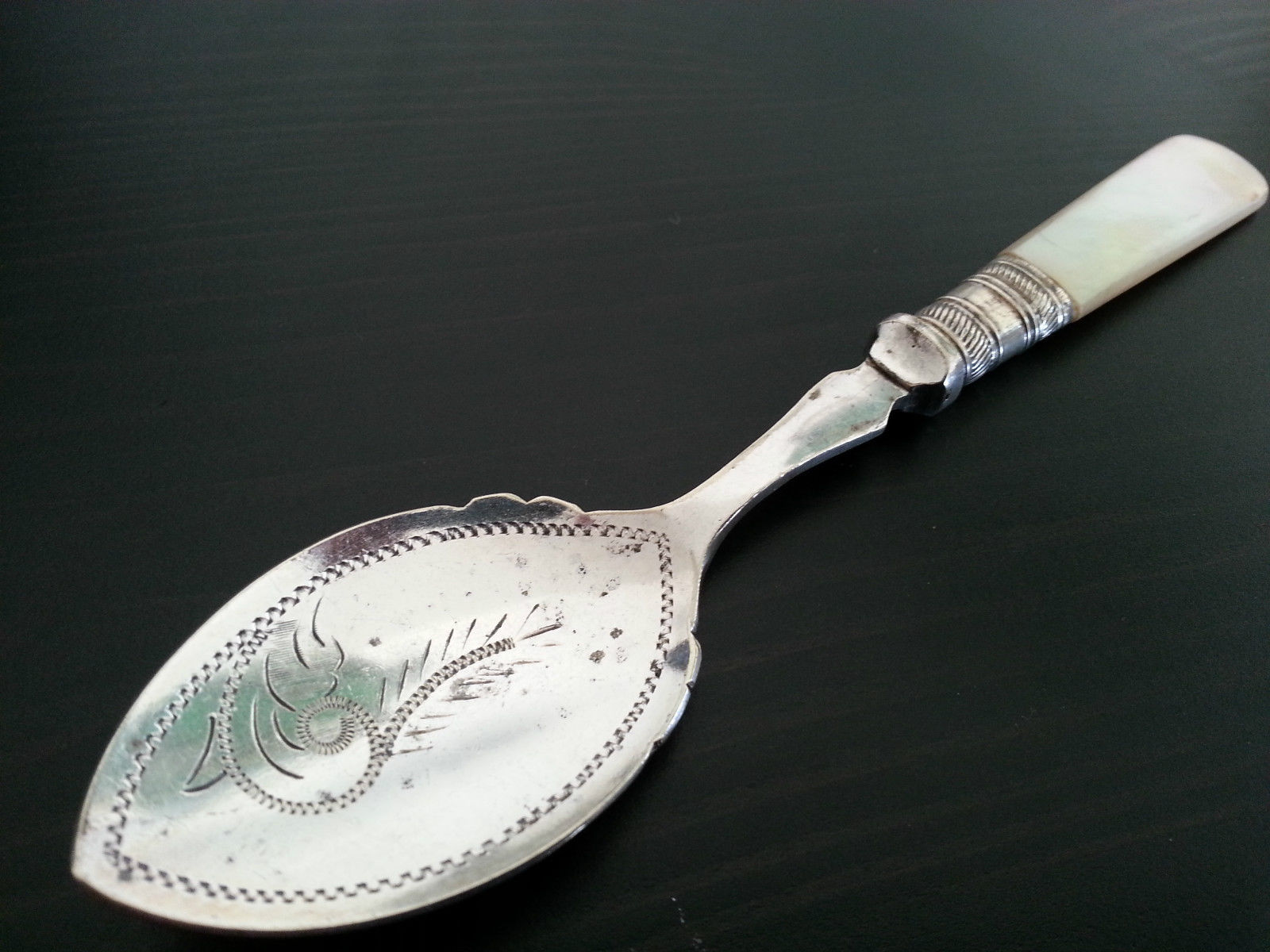 Antique ornamented desert silver plate spoon mother of pearl handle