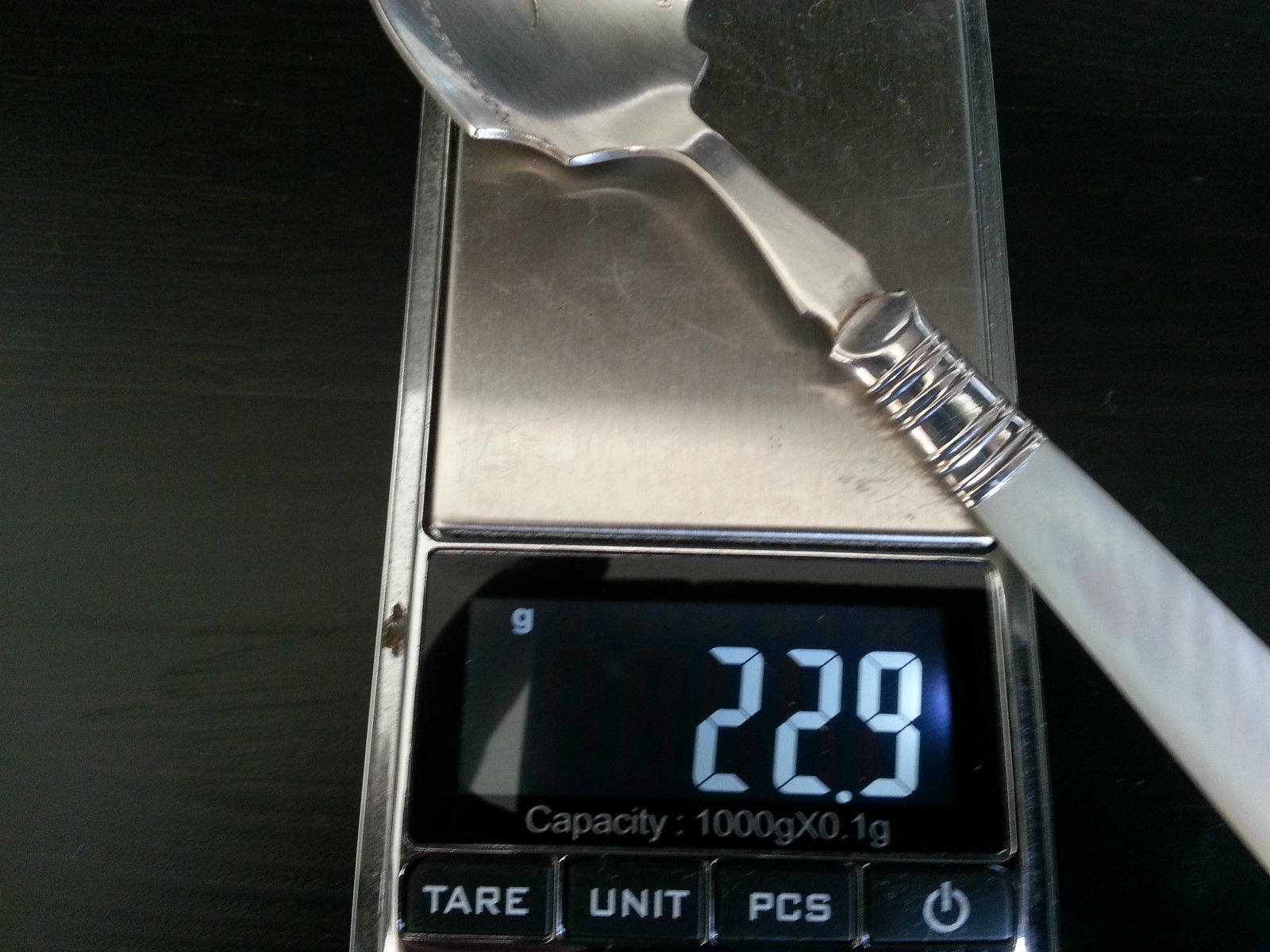 Antique silver plated dessert spoon ornamented with mother of pearl handle British Empire